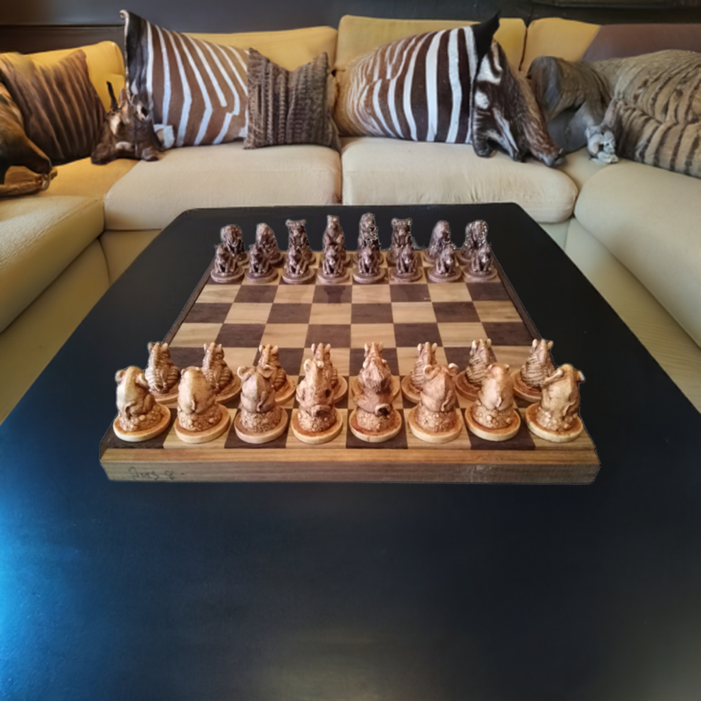 Hand crafted Big Five animal chess set resting on a table in a African themed living area.